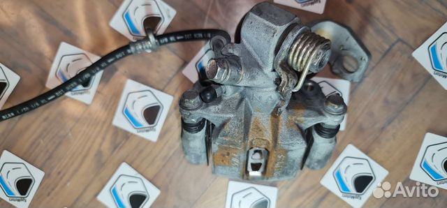 Суппорт задний левый тормозной Honda Civic 4D