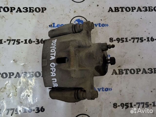 Суппорт передний правый toyota opa