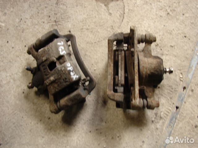 Суппорт задний L-R Мазда Кседос 9(Миления