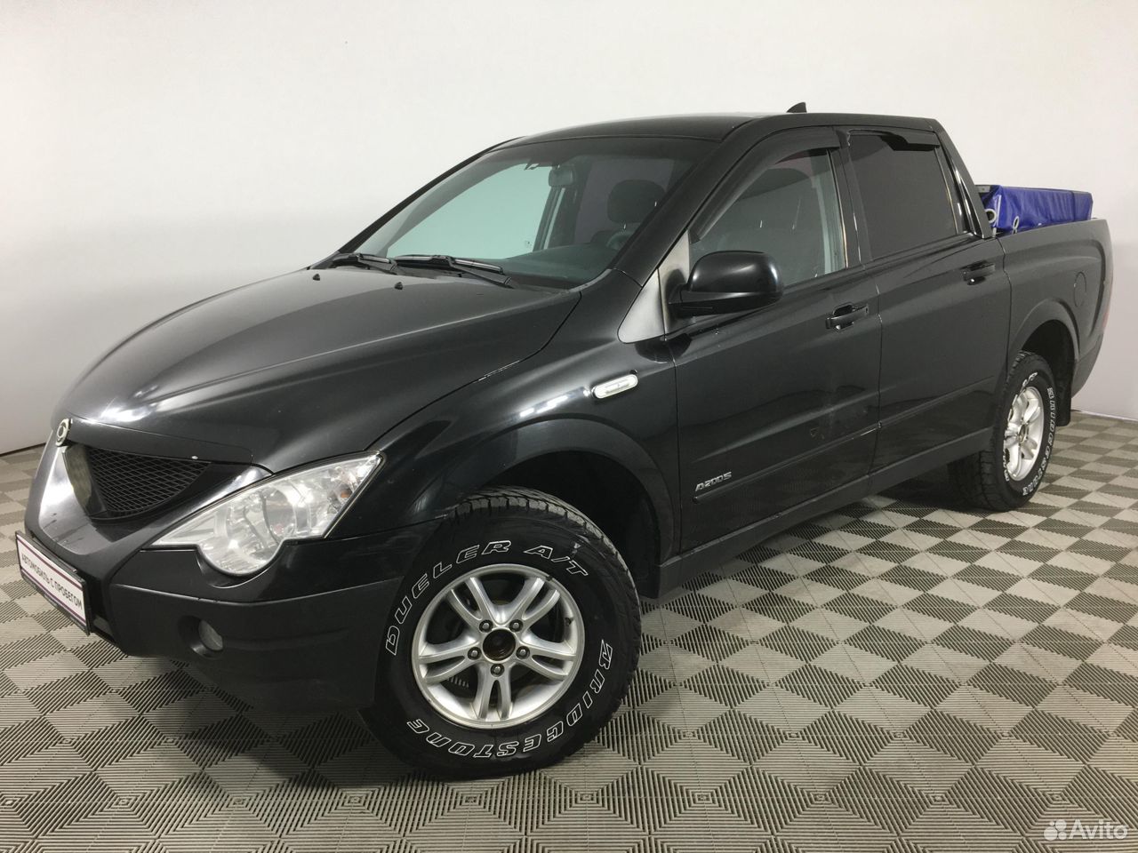 Актион спорт 2010. Ssang Yong пикап черный.